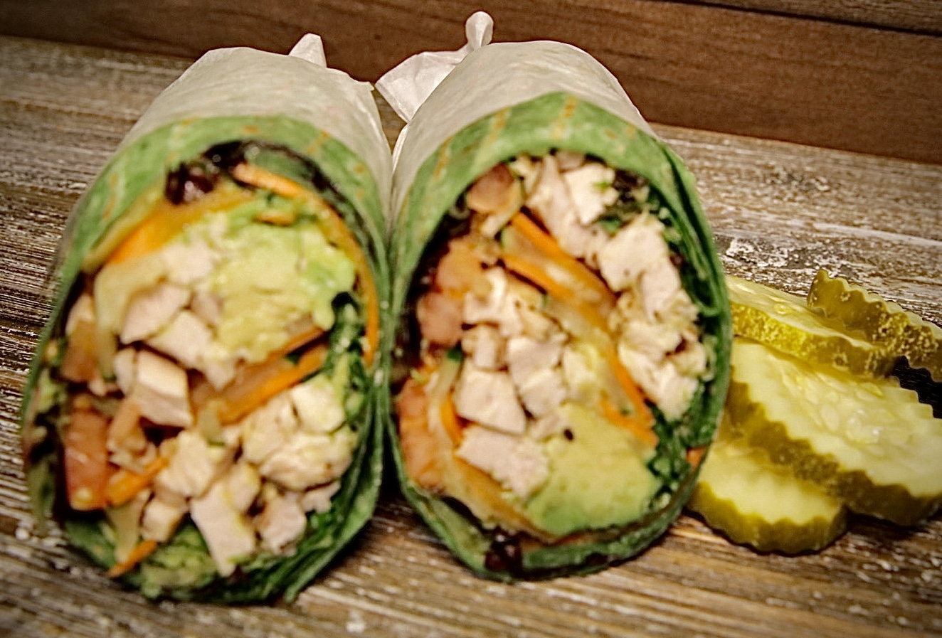 Gourmet chicken wrap sliced in half